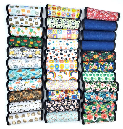 Assortment of neoprene luggage handle covers in horizontal style