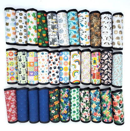 Assortment of neoprene luggage handle covers in vertical style