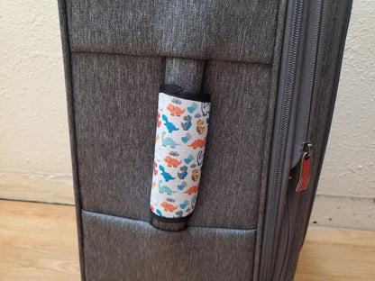 Neoprene luggage handle cover on a suitcase handle, vertical fit example