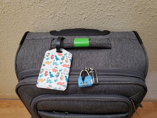 PU leather luggage tag attached to a suitcase handle